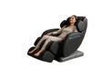 Woman relaxing in a massage chair with 'Breakthrough' branding on a white background