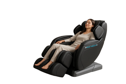 Woman relaxing in a massage chair with 'Breakthrough' branding on a white background