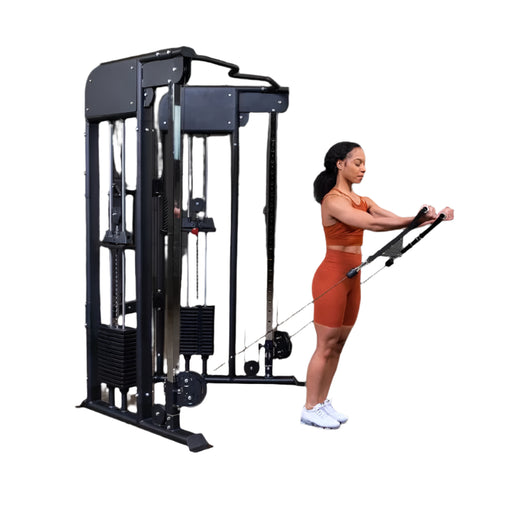 Woman exercising on a cable machine in a gym setting