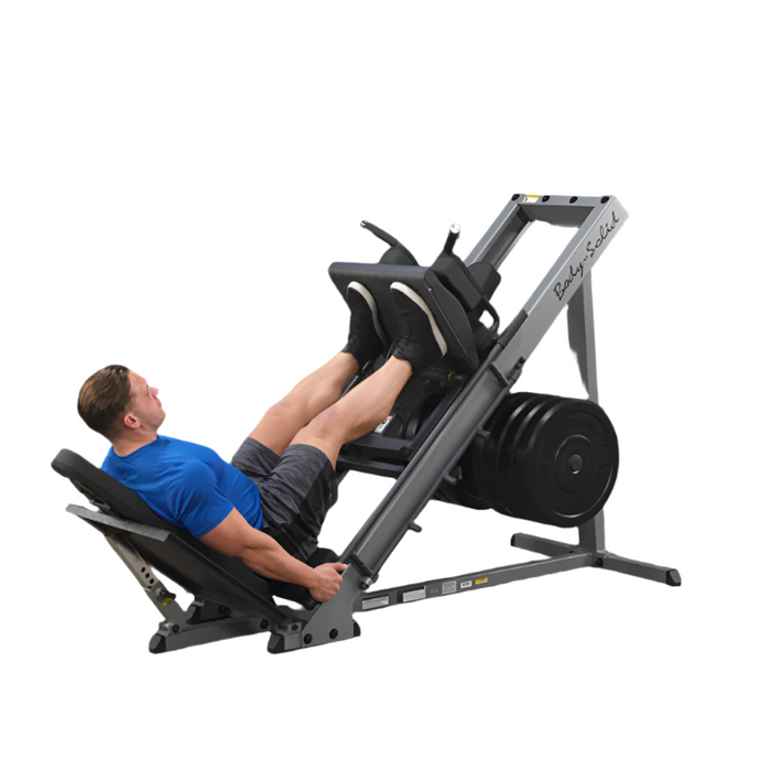 Man using a leg press machine in a gym setting