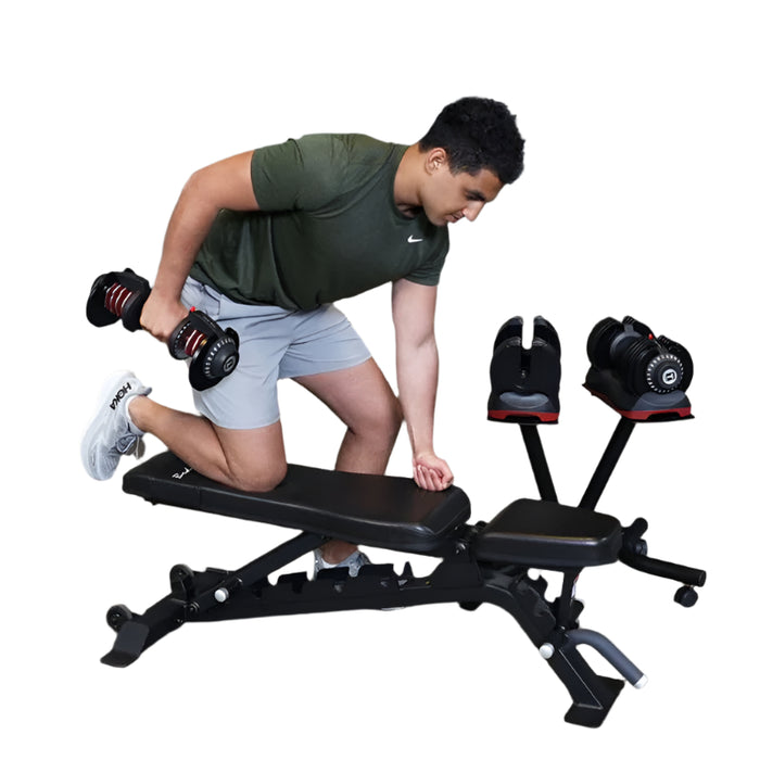 Man exercising with dumbbells on a weight bench in a gym setting