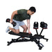 Man exercising with dumbbells on a weight bench in a gym setting